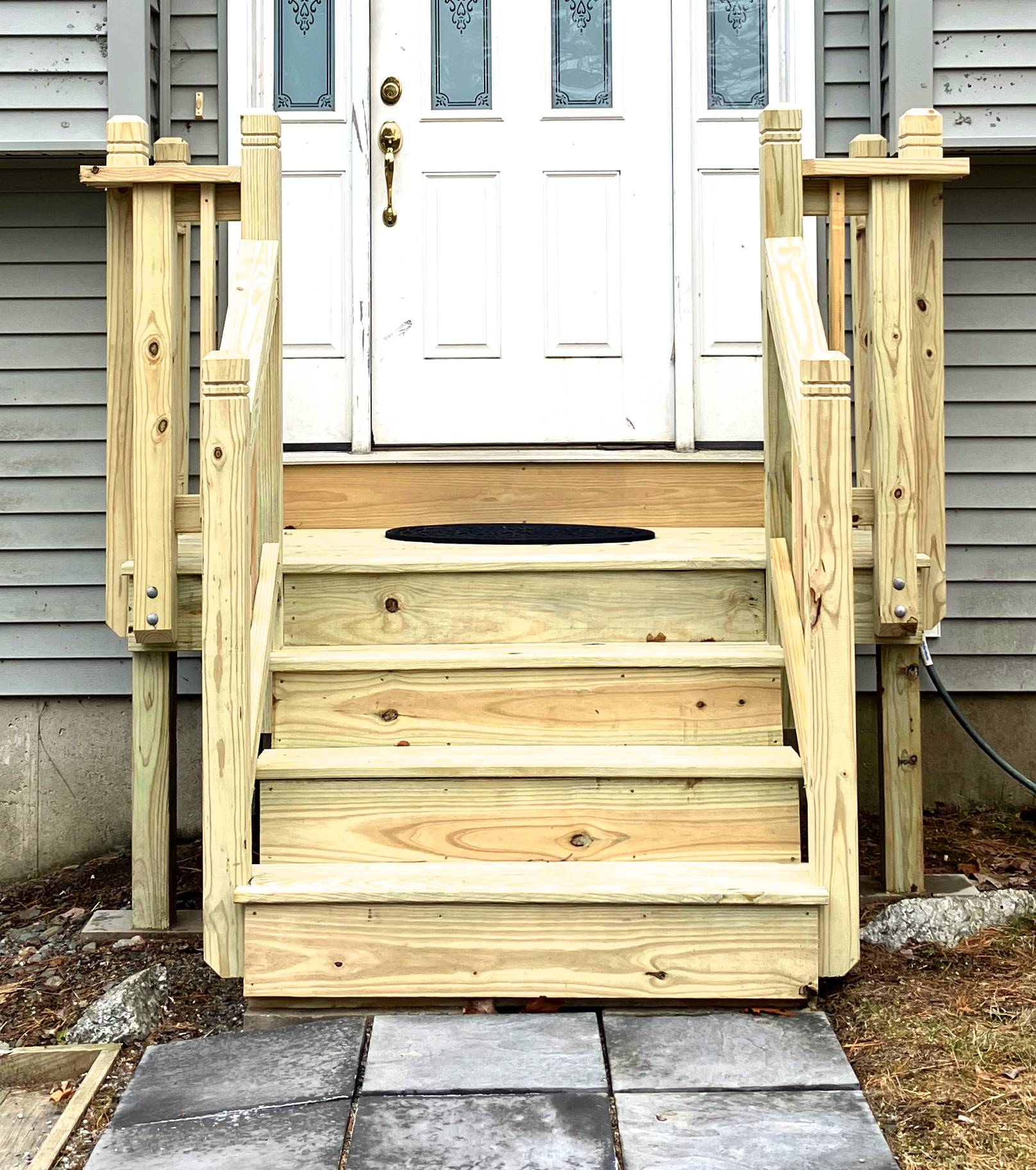 Rebuilt porch stairs with new railings
